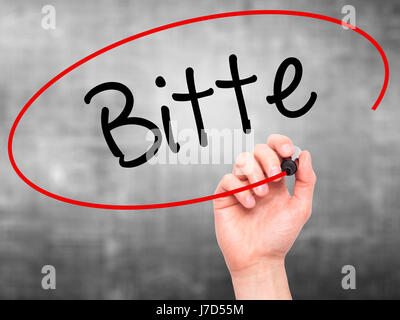 Man mano che scrive Bitte (si prega in tedesco) con pennarello nero su schermo visivo. Isolato su sfondo. Business, tecnologia internet concetto. Stock Ph Foto Stock