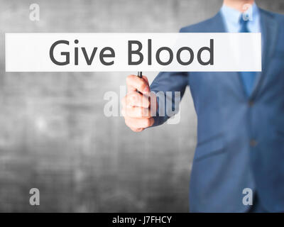 Donare il proprio sangue - Imprenditore mano azienda segno. Business, tecnologia internet concetto. Stock Photo Foto Stock