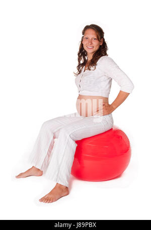 Incinta donna giovane con sfera Foto Stock