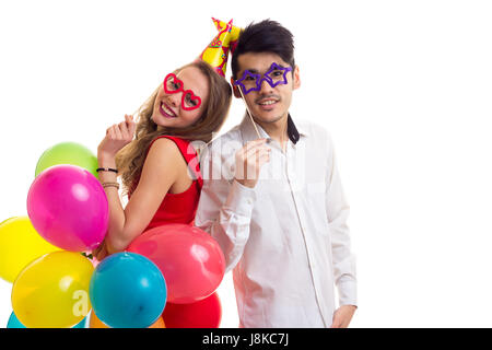 Coppia giovane con palloncini Foto Stock