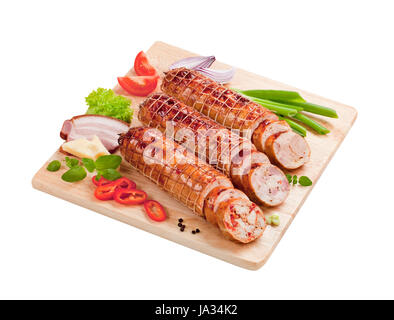 Arrosto di maiale e la Turchia rotoli su un tagliere Foto Stock