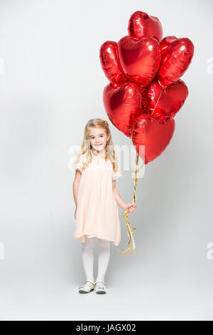 Ragazza con palloncini di aria Foto Stock