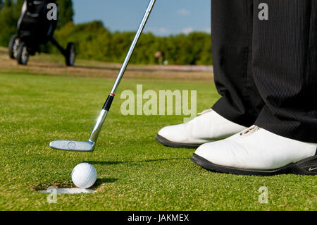 Juge Männer spielen Golf Foto Stock