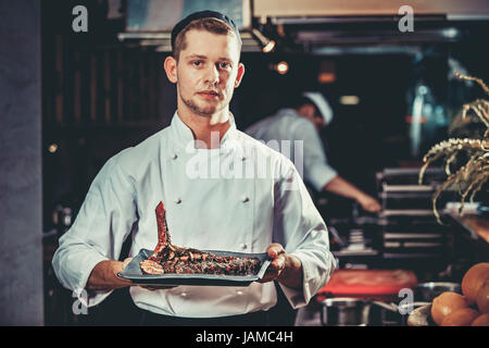 La preparazione tradizionale bistecca di manzo Foto Stock