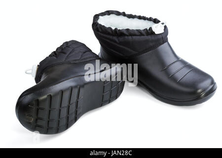 In gomma nero scarpe donna su sfondo bianco Foto Stock