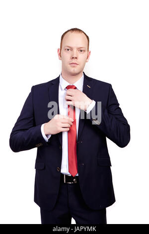 Ritratto di imprenditore, uomo bello indossare il manicotto lungo una camicia bianca, pantaloni neri. Foto Stock