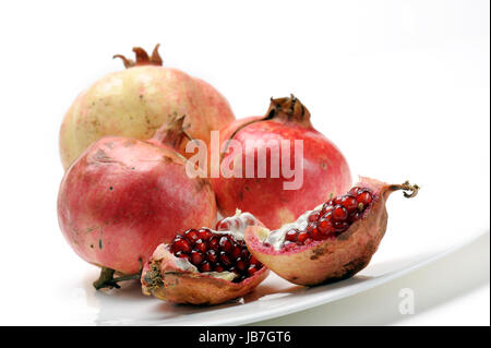 Set di melagrana con uno strato su piastra Foto Stock