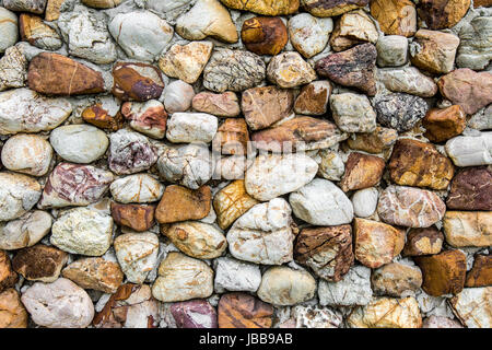 Dettagli di closeup muro di pietra che mostra la sua texture astratte e modelli Foto Stock