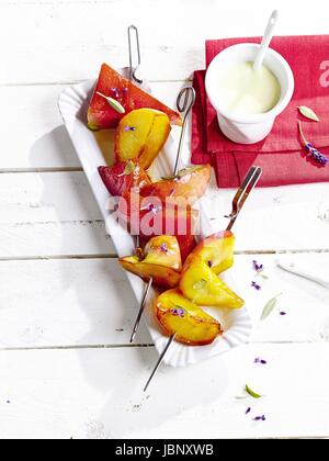 Arrosto di melone - apple - spiedini Foto Stock