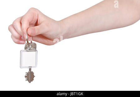 Mano con una chiave vergine fob isolati su sfondo bianco Foto Stock