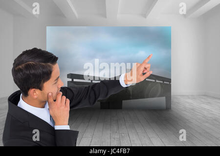 Immagine composita di pensosa asian businessman rivolta Foto Stock