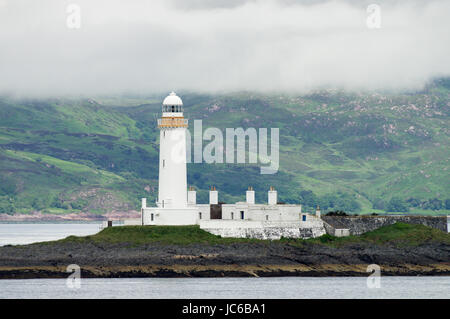 Eilean Musdile faro sul modo per il Isle of Mull nelle Ebridi Interne Foto Stock