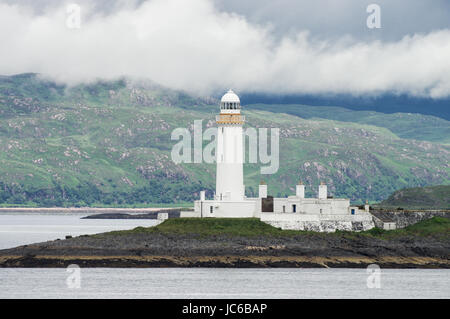 Eilean Musdile faro sul modo per il Isle of Mull nelle Ebridi Interne Foto Stock