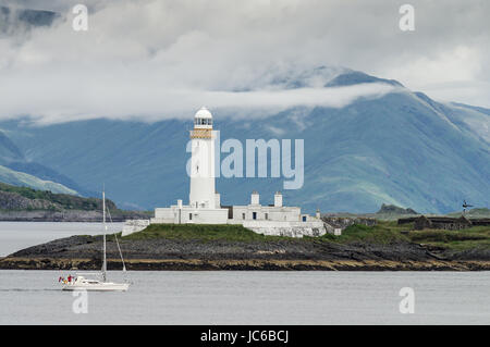 Eilean Musdile faro sul modo per il Isle of Mull nelle Ebridi Interne Foto Stock