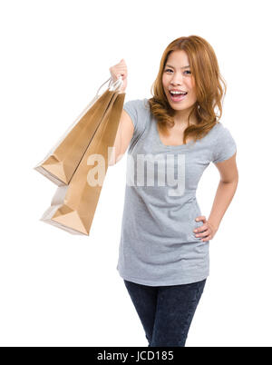 Donna effettuare shopping bag Foto Stock