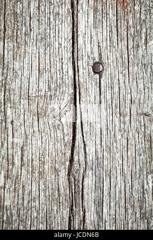 Sfondo composto da tavole di legno vecchio e un chiodo Foto Stock