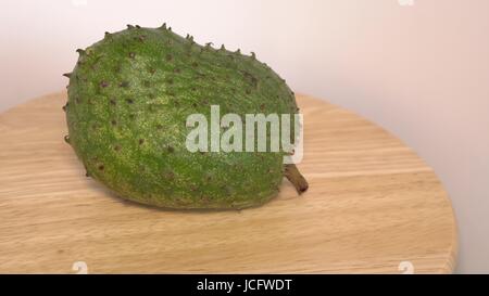 Soursop, fico d'India anone, Annona muricata L su un tavolo di legno. Foto Stock