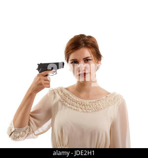 Una giovane donna che punta una pistola a se stessa Foto Stock