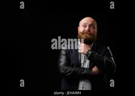 Malinconici uomo con barba di zenzero Foto Stock