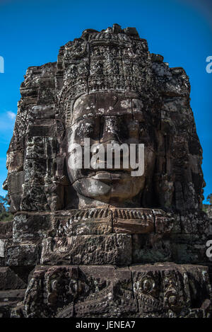 Scolpita in pietra faccia, tempio Bayon, Angkor Wat, Cambogia Foto Stock