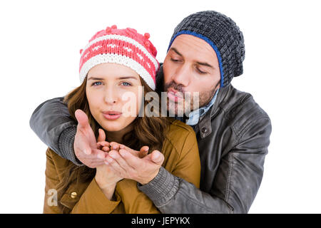 Felice coppia giovane soffiando kiss Foto Stock