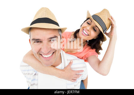 Uomo bello piggy backing la moglie Foto Stock