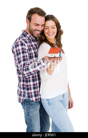 Felice coppia giovane azienda modello di casa Foto Stock