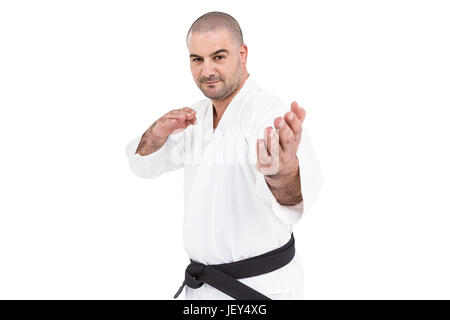 Fighter eseguendo il karate posizione Foto Stock