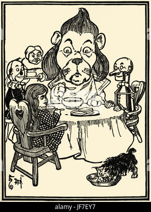 The Wizard of Oz da L. Frank Baum prenota . Illustrazione di W.W. Denslow. Didascalia: Il leone mangiato del porridge. (Sulla strada per la città di smeraldo)pubblicato da Bobbs Merryl. Autore americano, 15 maggio 1856 - 6 Maggio 1919 Foto Stock