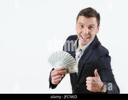Imprenditore con borra di denaro mostrano segno ok su uno sfondo bianco. Concetto di successo Foto Stock