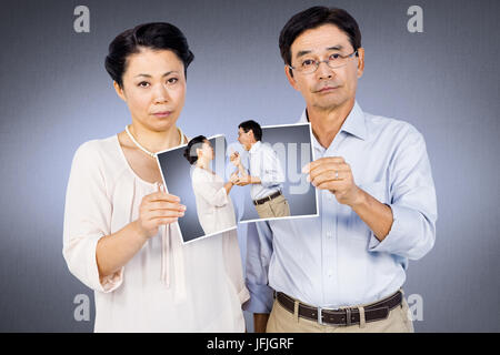 Immagine composita di asian giovane azienda una foto Foto Stock