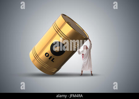 Imprenditore arabo holding barile di petrolio Foto Stock