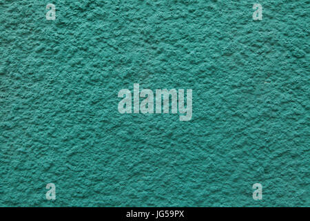 Verde smeraldo dipinti a muro in stucco. Texture di sfondo. Foto Stock