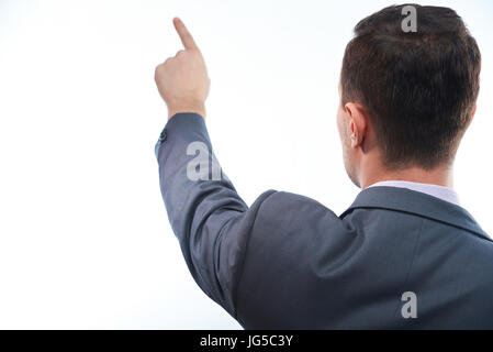 Uomo di Business point con il dito vista posteriore isolato su sfondo bianco Foto Stock