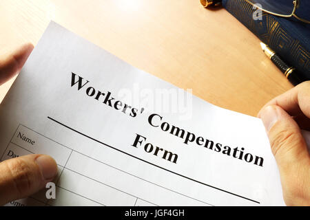 Compensazione Lavoratori modulo su una tabella. Foto Stock
