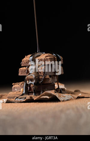 Il cioccolato al latte spruzzato con sciroppo Foto Stock