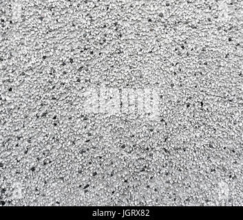 Lo sfondo da piccole pietre e sabbia. Bright bianco e nero texture di pietra Foto Stock