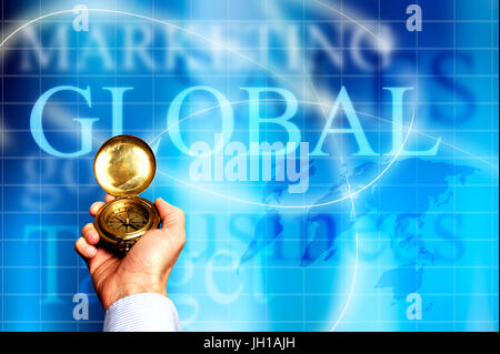 hand holding a compass to show directions, global markets and business decisions concept Foto Stock