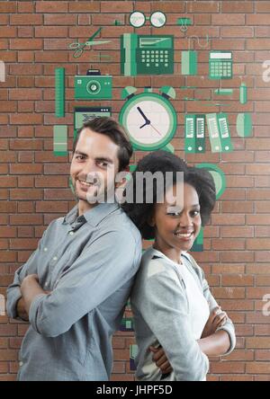 Composito Digitale di felice la gente di affari in piedi contro un muro di mattoni con grafica Foto Stock