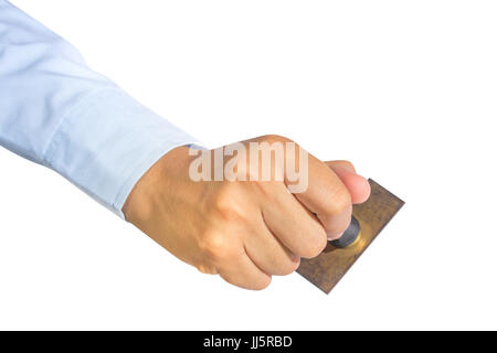 Vista superiore lavoratore mano che tiene il vecchio timbro di gomma isolare su bianco, il concetto di lavoro Foto Stock