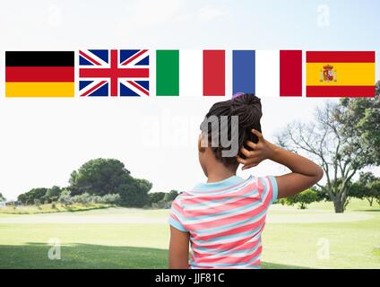 Composito Digitale della lingua principale flags over ragazza nel parco Foto Stock