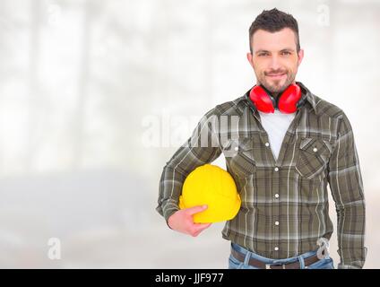 Composito Digitale del lavoratore edile di fronte la silvicoltura sito in costruzione Foto Stock