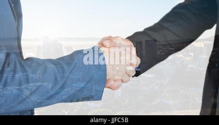 Composito Digitale di handshake senza titolo si sovrappongono con la città Foto Stock