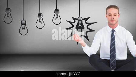 Business man meditando in camera grigia con 3D grafica di lampadine Foto Stock