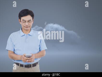 L'uomo texting davanti a un 3D dark cloud Foto Stock