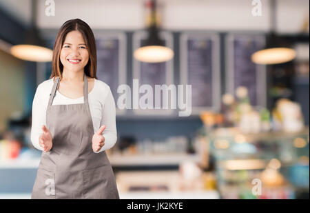 Asian business proprietario con un panificio sfondo Foto Stock