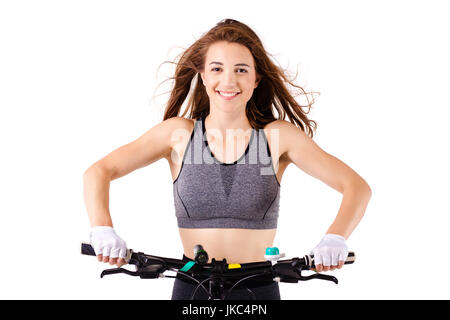 Ragazza posa con la mountainbike contro uno sfondo bianco Foto Stock