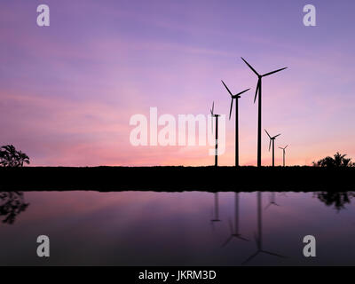 Silhouette turbine eoliche con Cielo di tramonto sullo sfondo Foto Stock