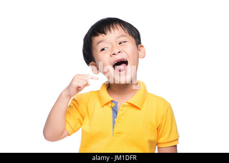 Perso il latte dente ragazzo asiatico, vista ravvicinata. Foto Stock