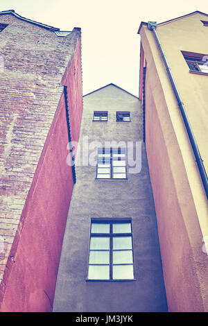 Vintage stilizzata in edifici di vecchia costruzione di facciate in Torun, Polonia. Foto Stock